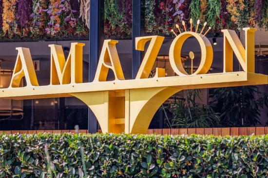 Amazon sign at Menlyn shopping centre with modern architecture and floral decor in Pretoria, South Africa.