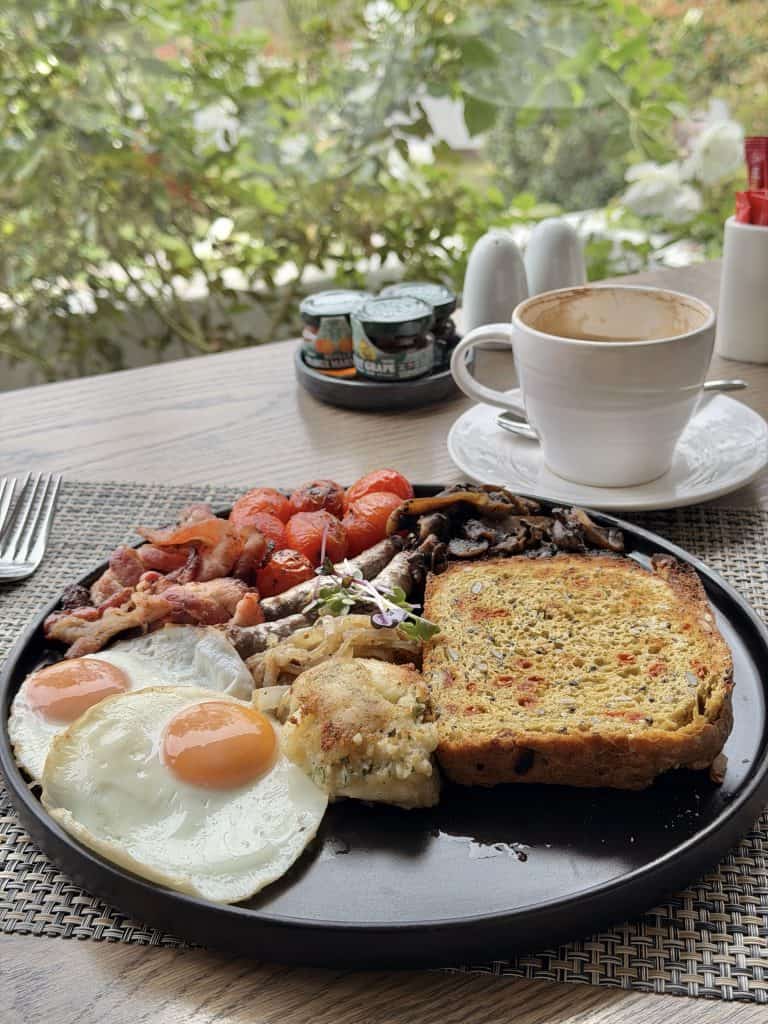 Classic Chateau with eggs of choice, bacon, boerewors, potato rosti, brown mushroos, blushed tomatoes, caramelised onion, health loaf
